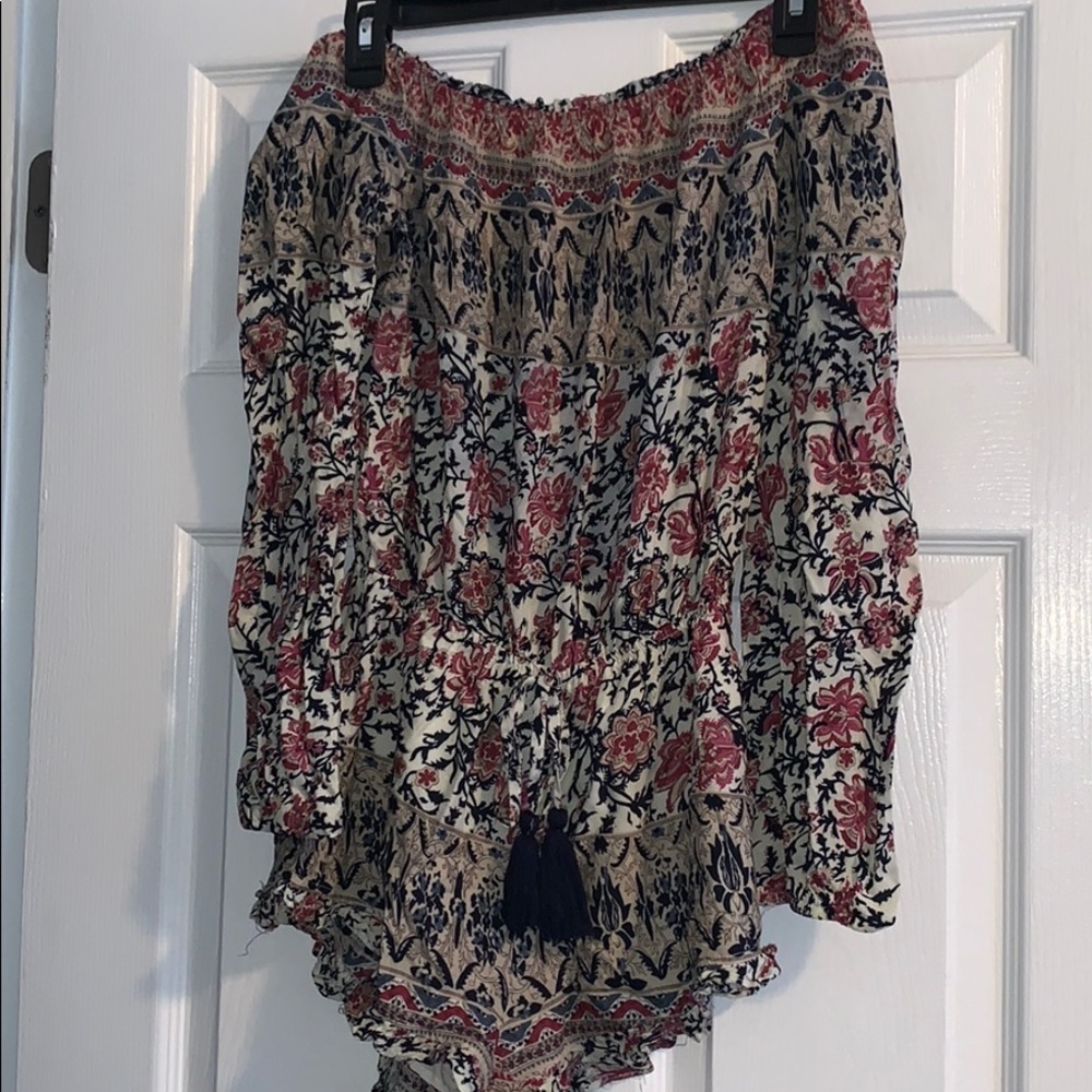 Patterned long sleeve romper.